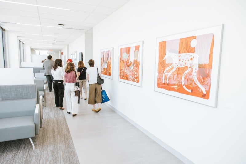 Orange and white animal art pieces in frames