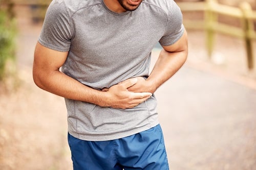 person holding stomach