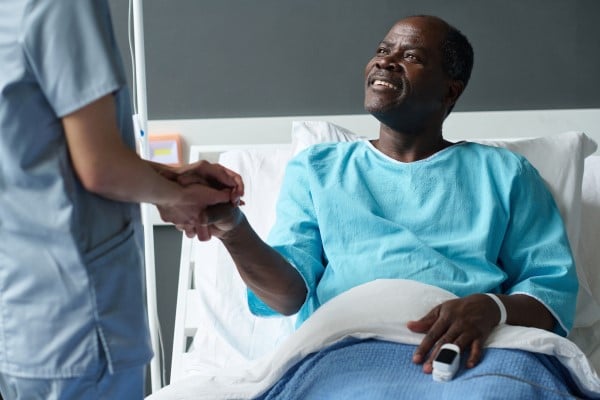 A patient being attended to by a nurse