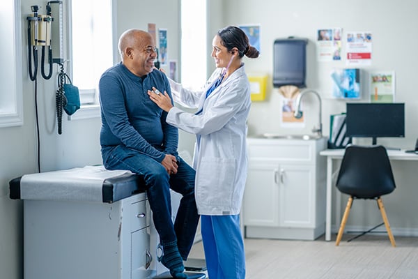 Patient and doctor in an exam room