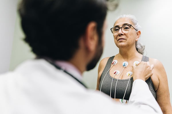 Patient having chest electrodes applied