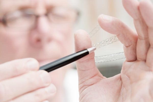 A doctor examining a wire stent