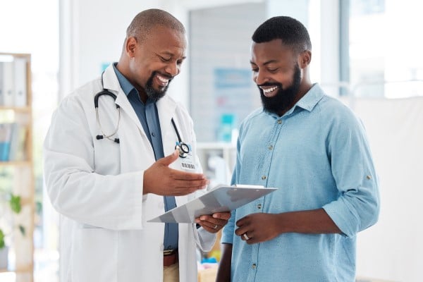 Patient and doctor looking at test results