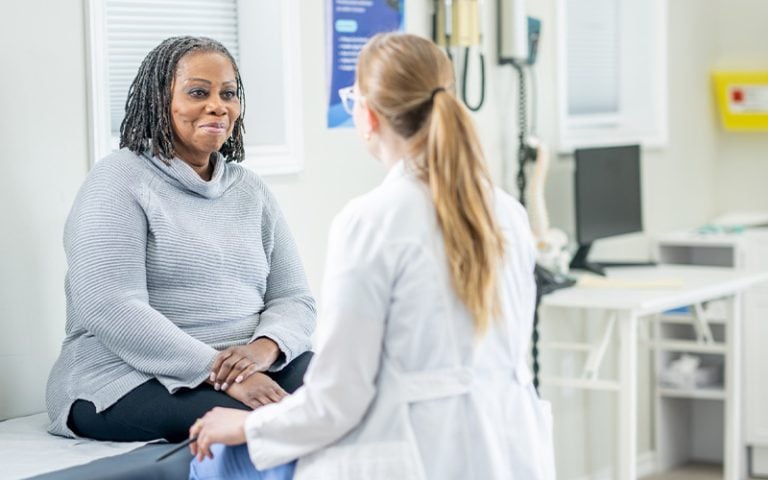 Patient and doctor in exam room