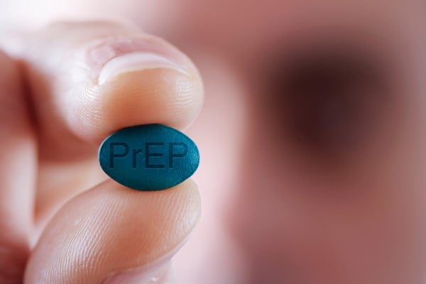 image of hand holding PrEP pill