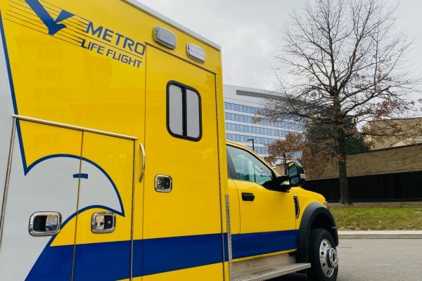 A Metro Life Flight ambulance parked near the Glick Center