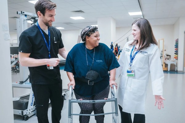 A MetroHealth Rehabilitation patient walking with assistance