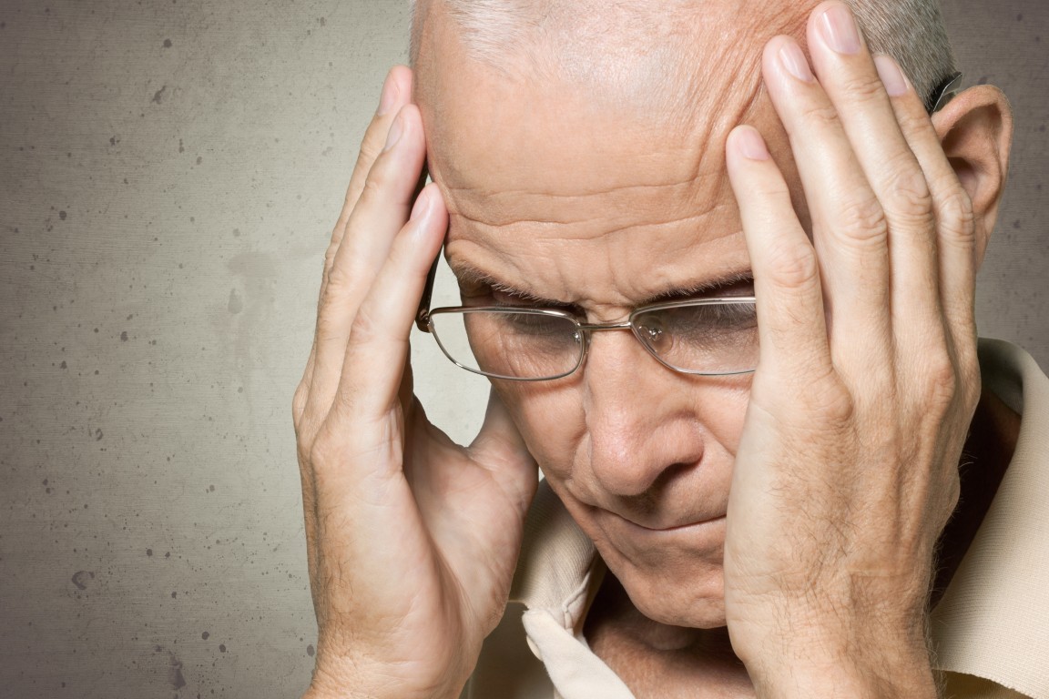 A man experiencing a severe headache