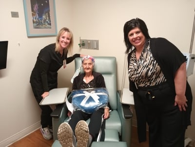 A MetroHealth patient receiving a gift blanket