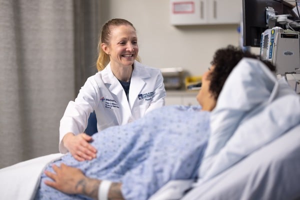 An OB-GYN provider attends to a patient