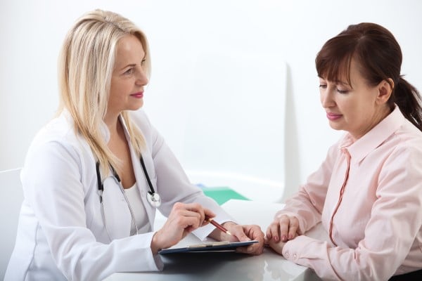 doctor and patient reviewing prescription plan