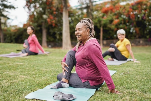 Women on yoga match stretching