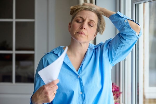 A menopausal woman feeling exhausted