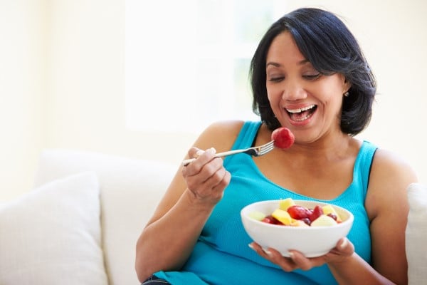 woman eating fruit