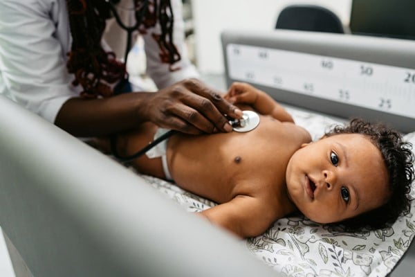 doctor examining baby