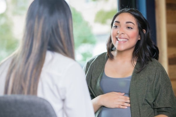 expecting mother meeting with doctor