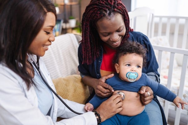 doctor examining baby