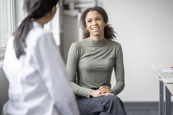 A woman talking with her doctor