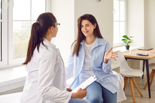 Woman discussing with a doctor