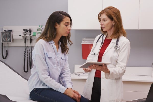 Young woman meeting with doctor