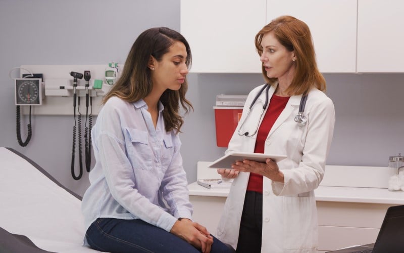 Young woman meeting with doctor