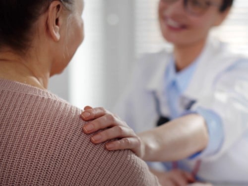 provider and patient embracing