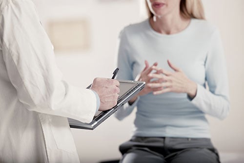 Woman talking with her OBGYN doctor
