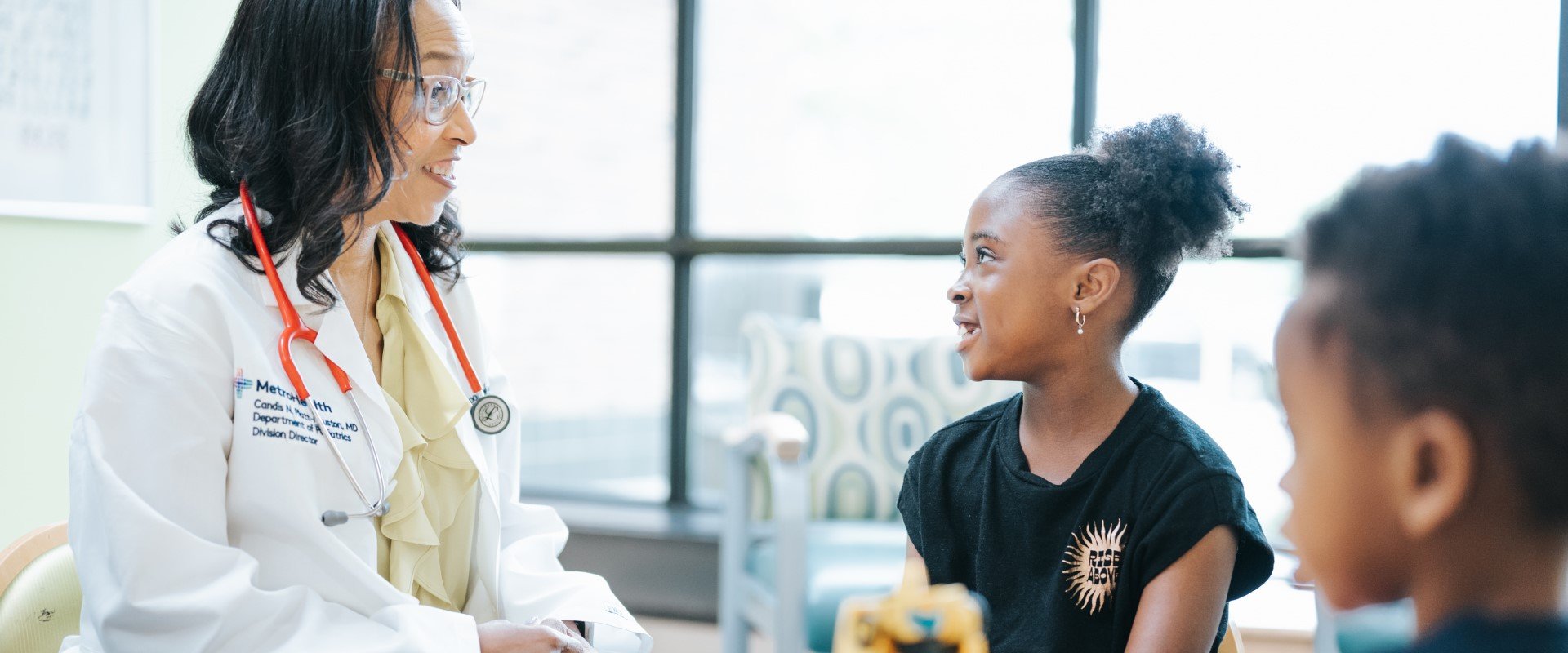 Pediatrician with patients