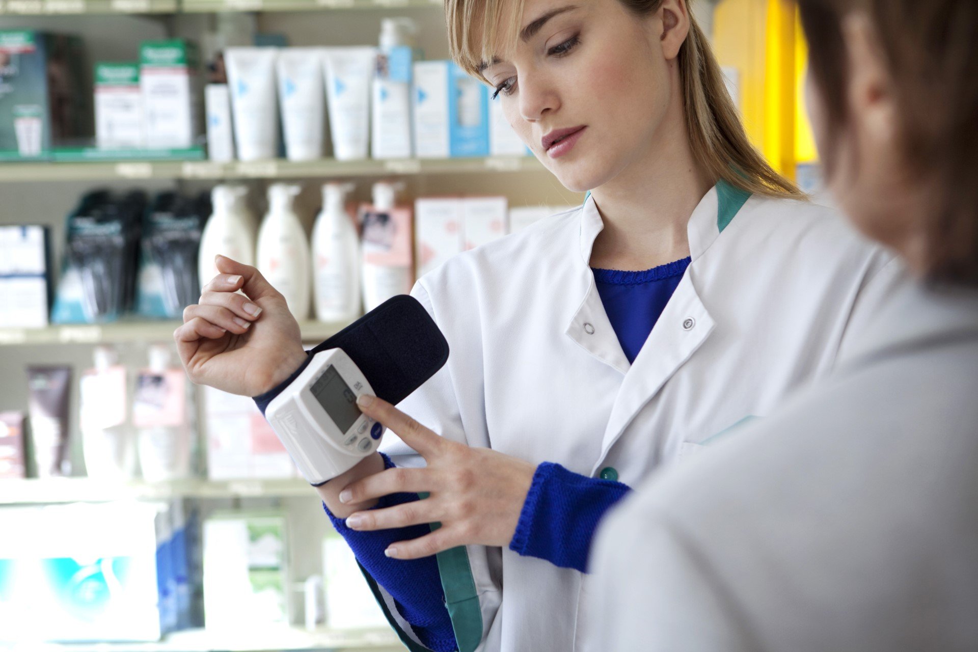 Pharmacist showing monitor
