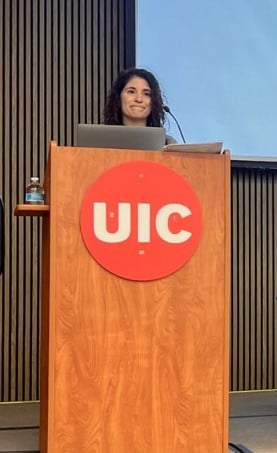 Susan De Luca giving a speech from a podium