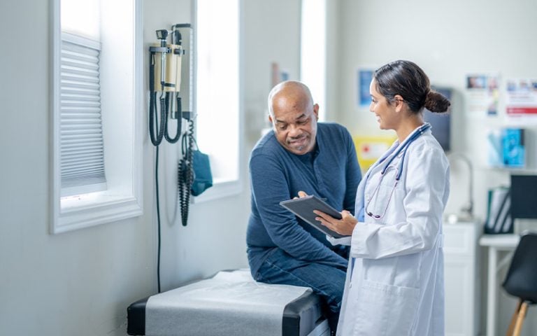 A patient and provider looking over a treatment plan together