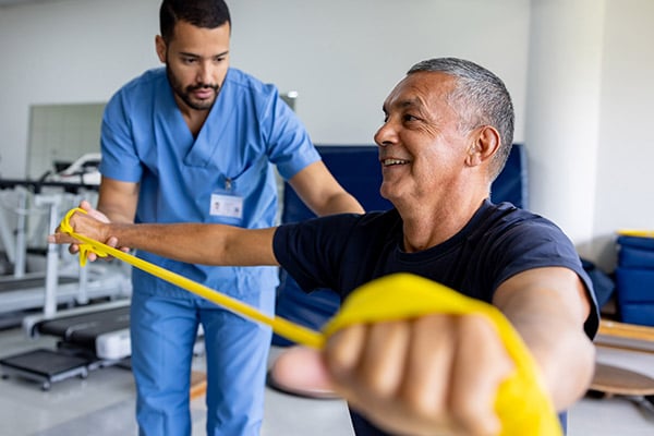 A patient practicing a resistance band exercise