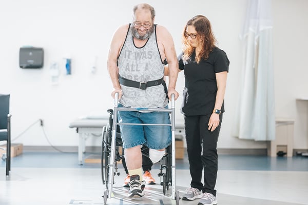 Patient with walker working with provider