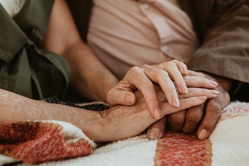 hands holding one another