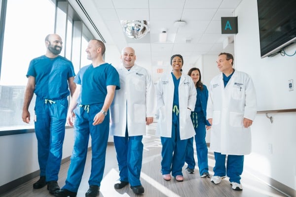 MetroHealth robotic surgeons walking down a hallway