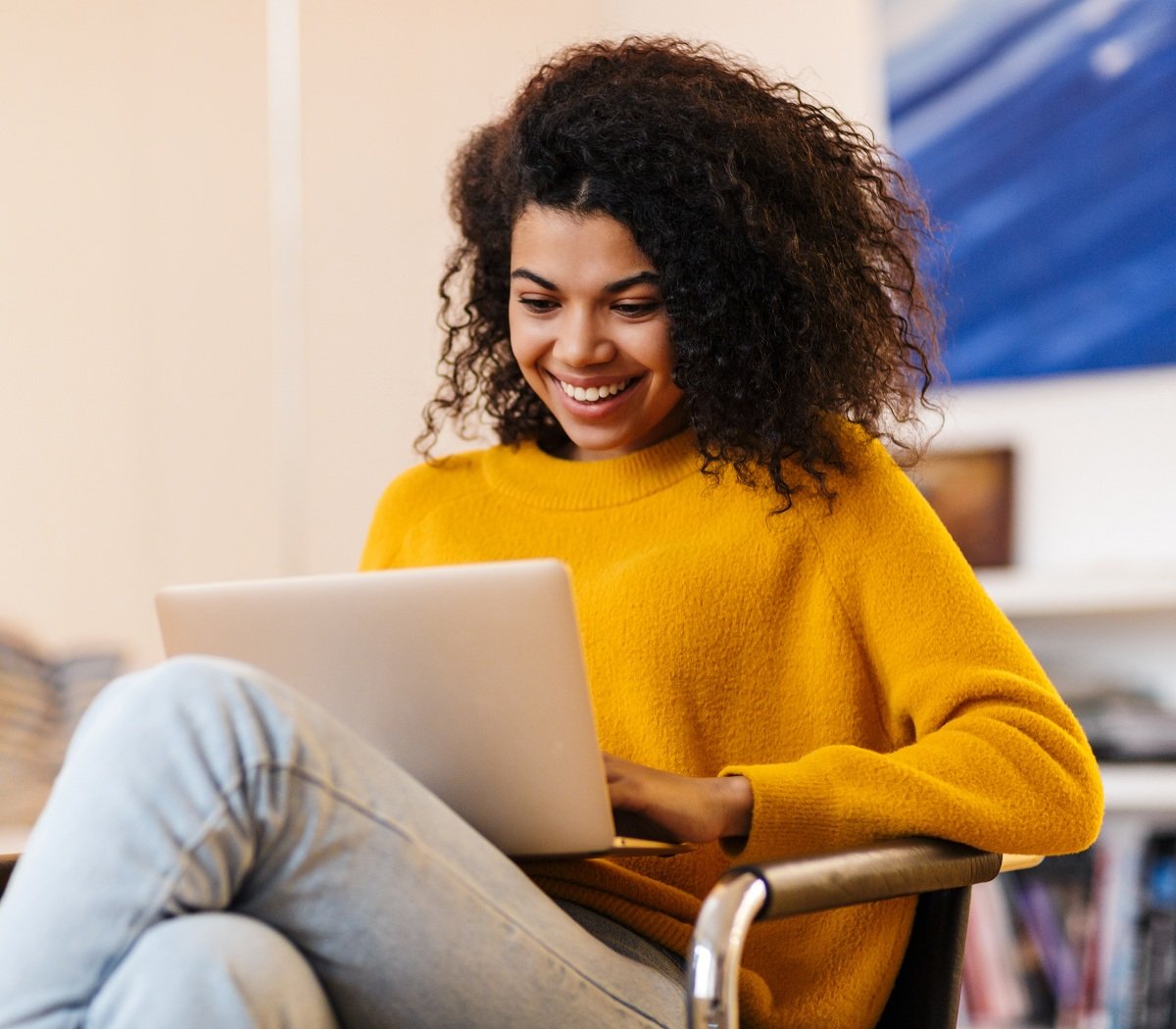 Woman on couch with computer