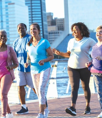 A group of women on a shoreline boardwalk