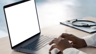 Person typing on laptop