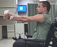 individual in wheelchair holding simulator