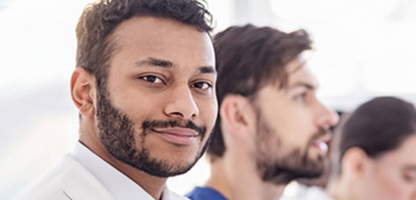A medical resident smiling