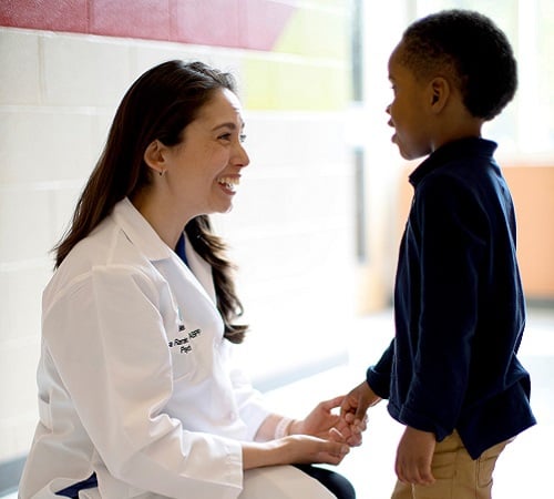 Lisa Ramirez dancing with pediatric patient